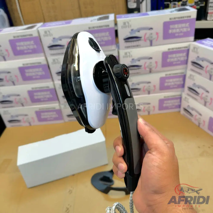 A handheld, black and white portable garment steamer with a foldable handle.