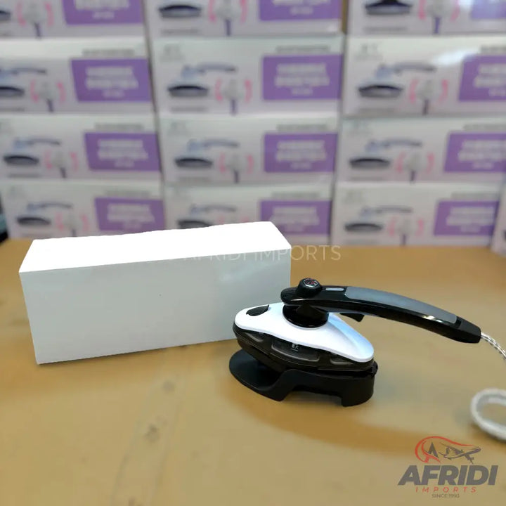 A compact, portable electric iron with a foldable handle.