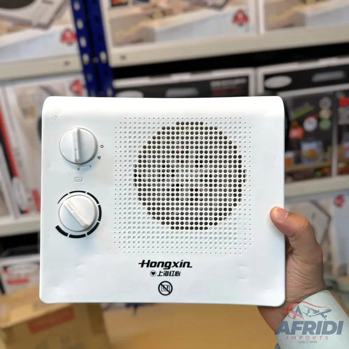 White portable electric heater with two control knobs and a perforated grille.