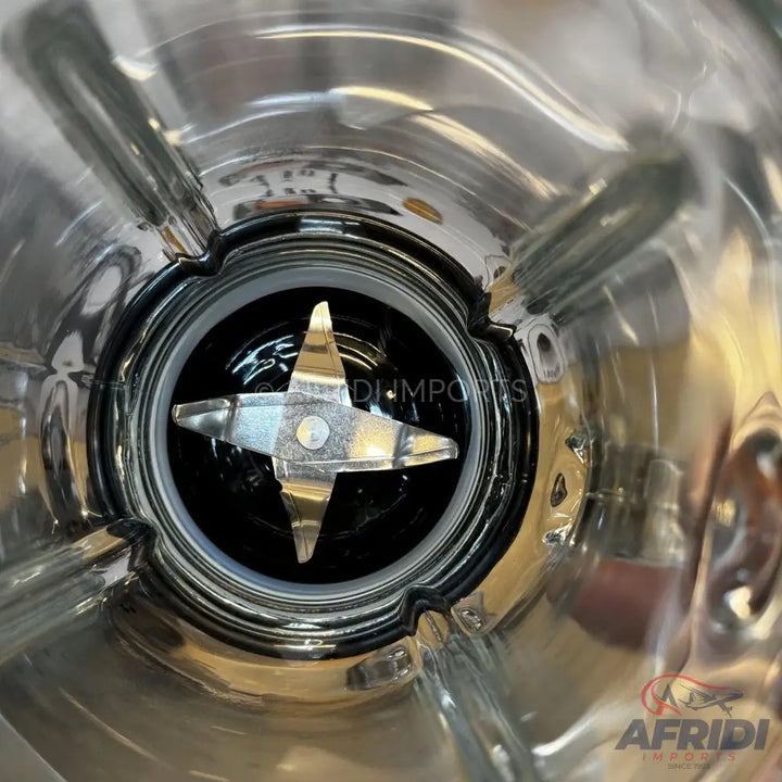Stainless steel blender jar with a four-blade assembly.