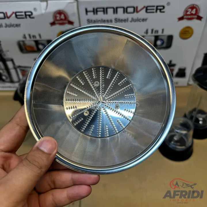 Stainless steel juicer filter with a central grater and perforated mesh.