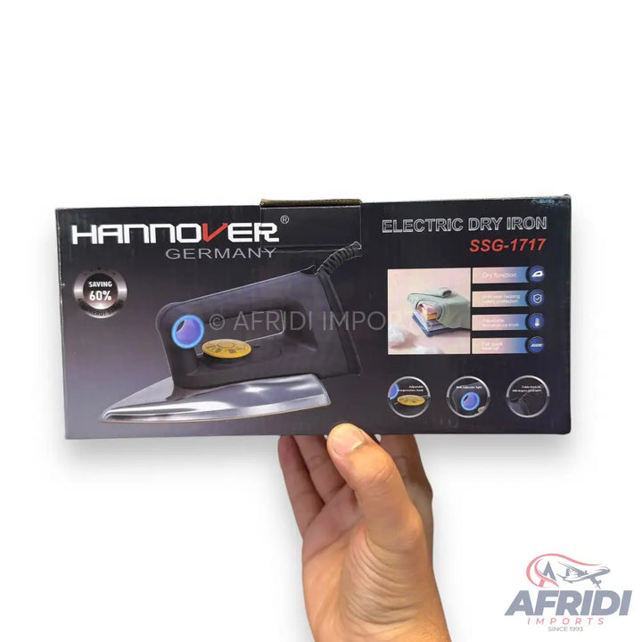 A black electric dry iron in its product box.