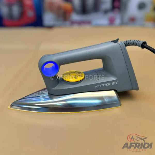 A gray dry iron with a blue and yellow button, and a chrome soleplate.