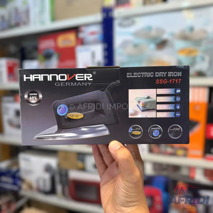 Black ’Hannover Germany’ electric dry iron, model SSG-1717, with a blue temperature dial and a silver soleplate.