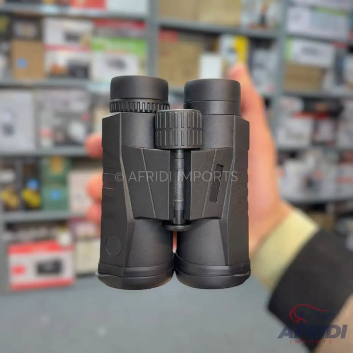 Black binoculars held by a hand.