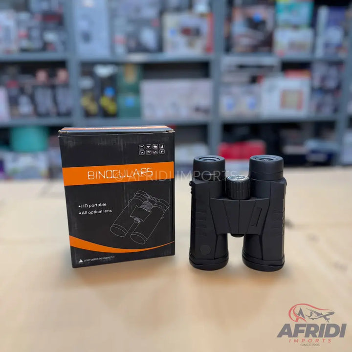 Black binoculars with their retail packaging.