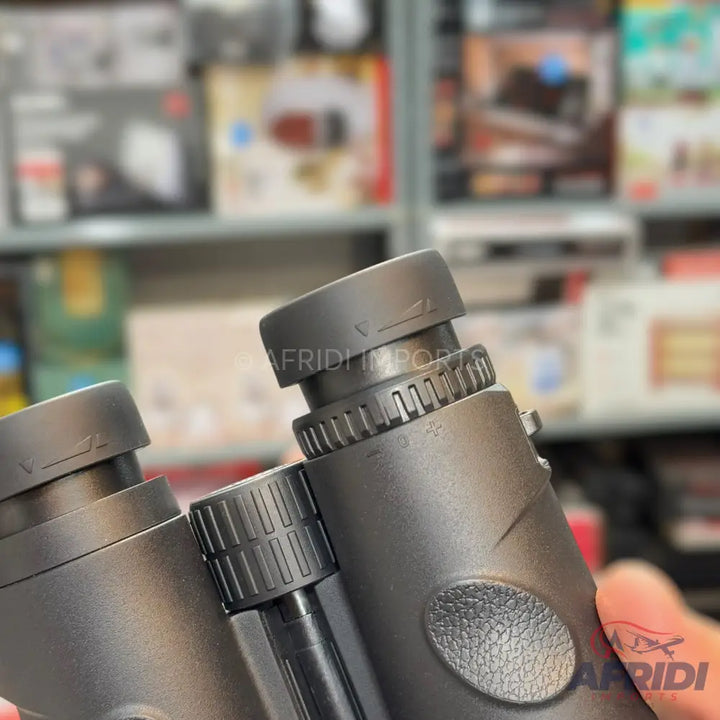 Black binoculars with adjustable eyepieces and textured grip.
