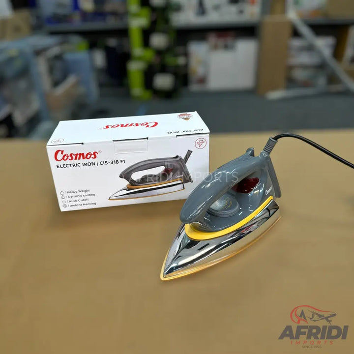 A gray and yellow electric iron with a shiny silver soleplate.