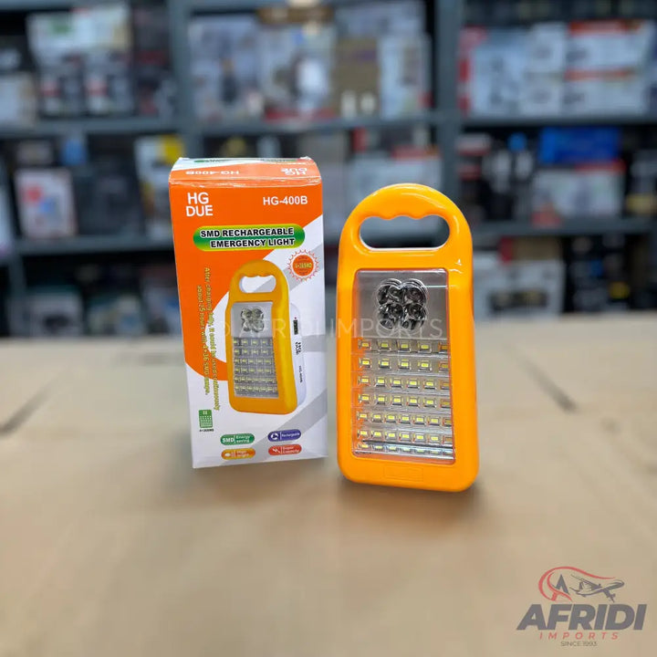An orange rechargeable emergency light with multiple LED bulbs.