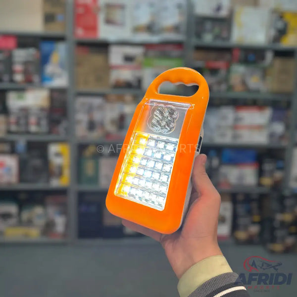 Orange handheld LED lantern with multiple light modes.
