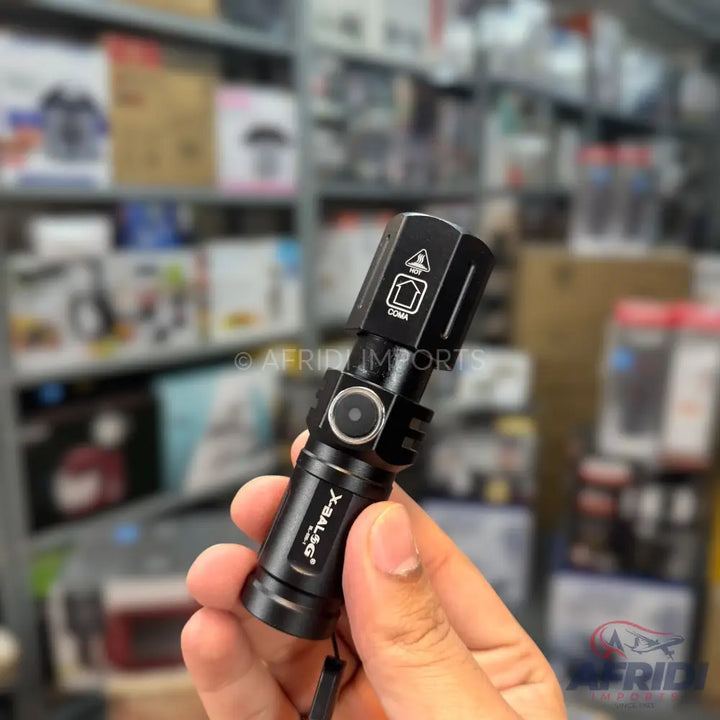 Black tactical flashlight with a side-mounted power button.