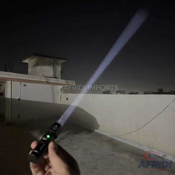 A black hilt with a glowing white blade, likely a toy or replica sword.
