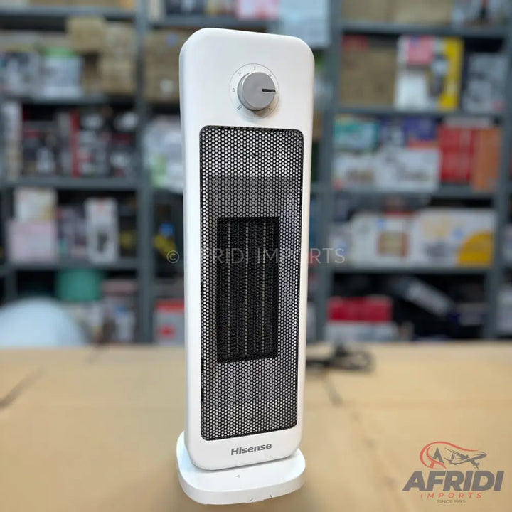 White tower-style electric space heater with a black mesh grill and a single control dial.