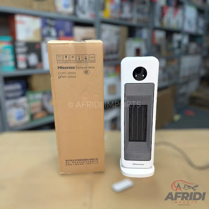 White and black electric tower heater with a remote control.