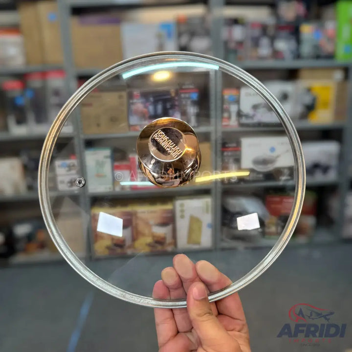Round glass pot lid with a rose gold knob.