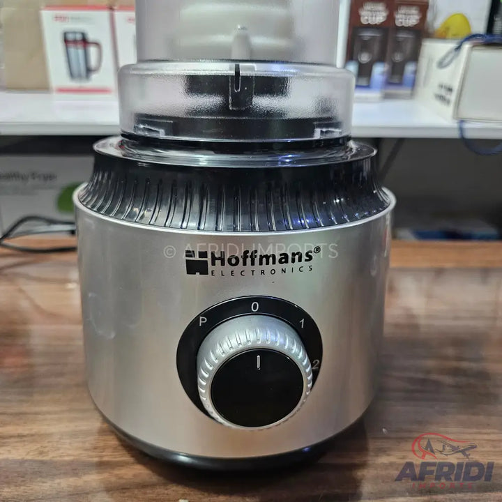 Silver and black food processor with a transparent top and a rotary control dial.