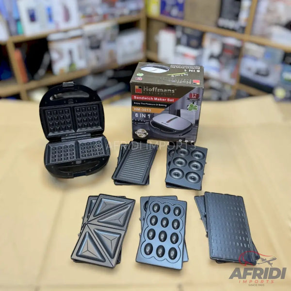 A black 6-in-1 sandwich maker set with interchangeable plates for waffles, sandwiches, donuts, and grilling.