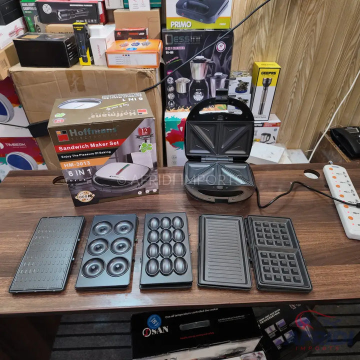 A multi-function sandwich maker set with interchangeable plates for different snacks.
