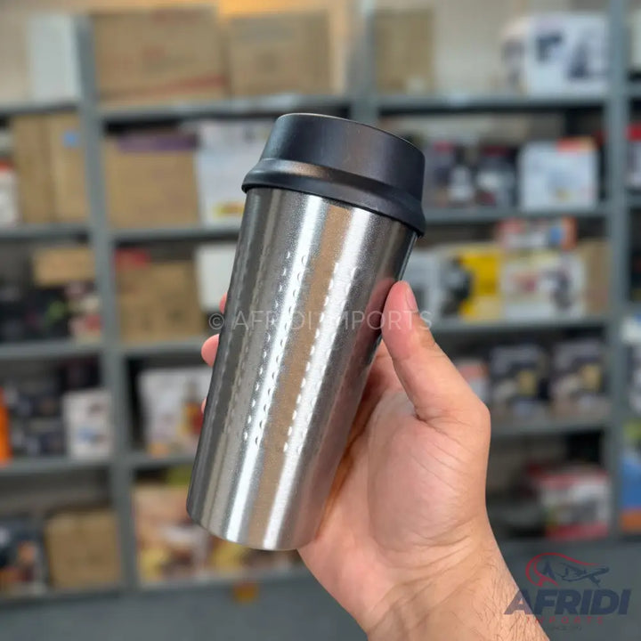 Stainless steel travel mug with a black lid.