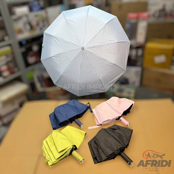 A variety of open and folded umbrellas in different colors.