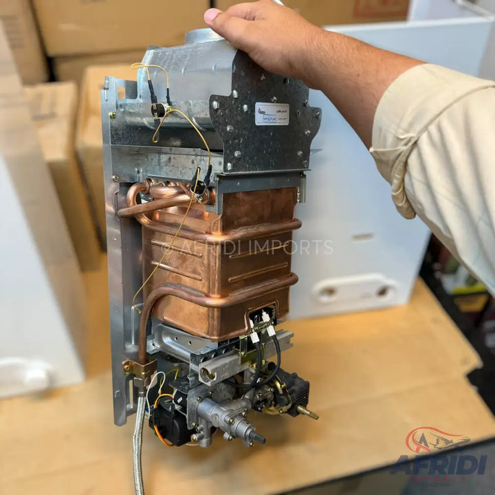 An exposed copper heat exchanger and gas valve assembly for a water heater or boiler.