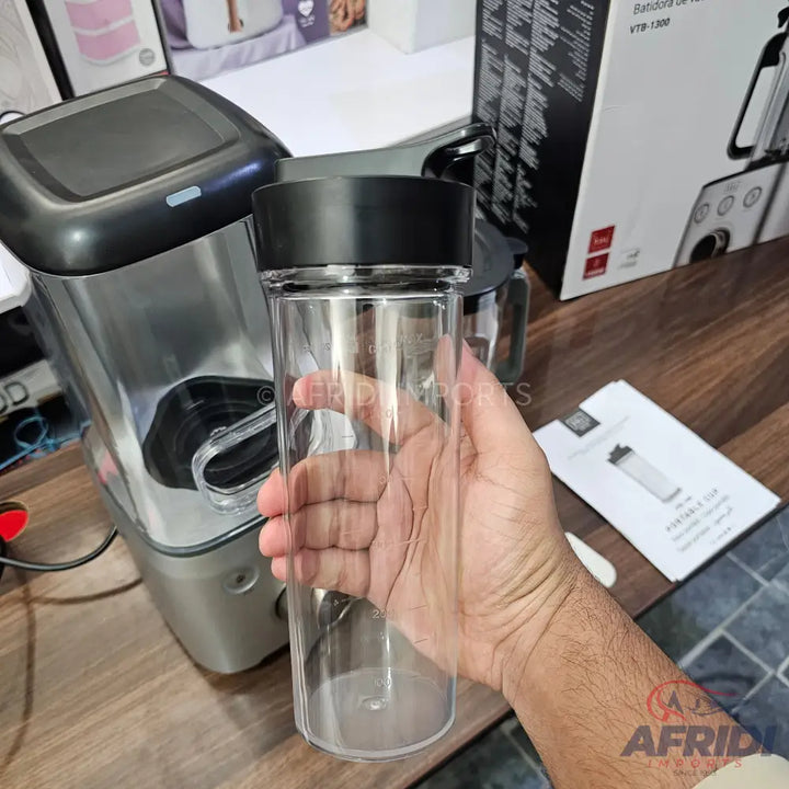 A personal blender with a clear, portable blending cup.