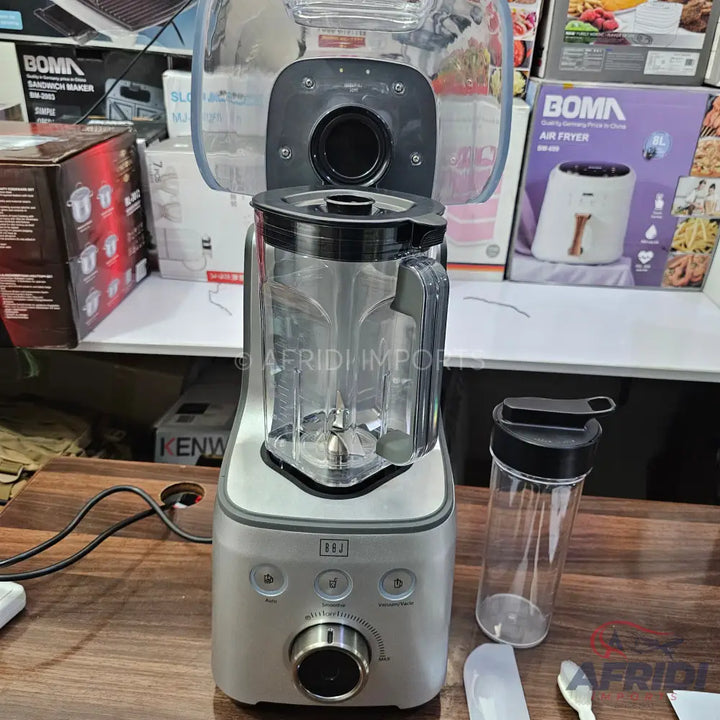 Silver blender with a clear pitcher, control panel, and an additional portable blending cup.
