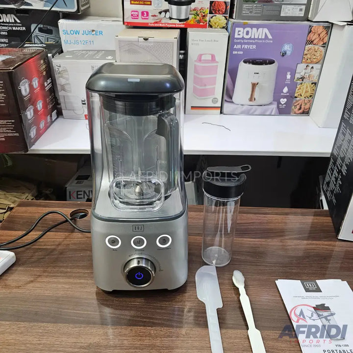 A countertop blender with a transparent pitcher and a control panel with a central knob and three illuminated buttons.