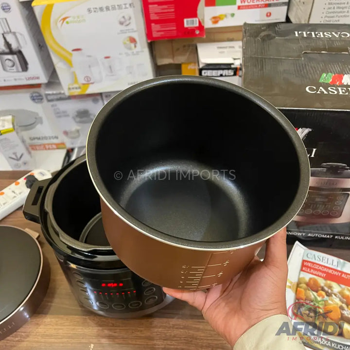 A brown and black multi-cooker with a removable inner pot.