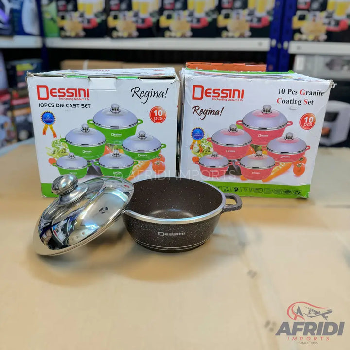 Two sets of Dessini Regina cooking pots, one green and one pink, with a single brown pot and lid in the foreground.