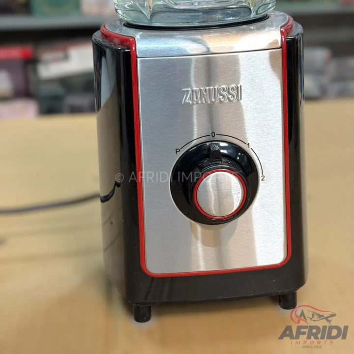Black and silver countertop blender with a speed dial.