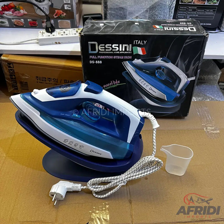 A blue and white cordless steam iron with a charging base and a measuring cup.