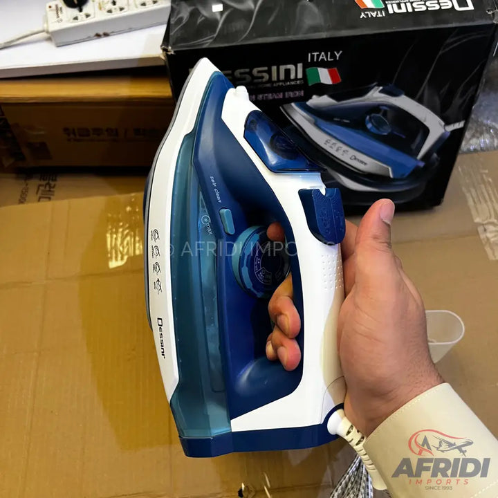 A white and blue steam iron with a textured handle.