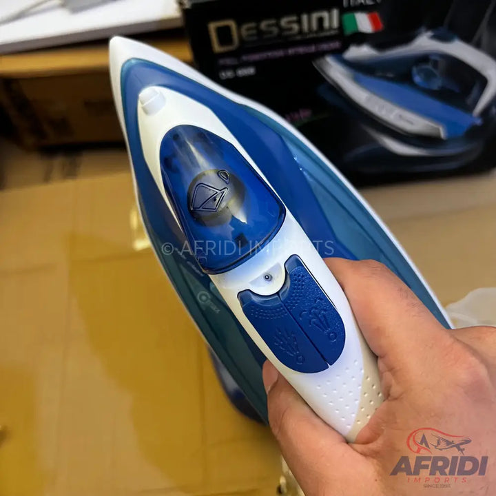 A blue and white steam iron with a textured handle.