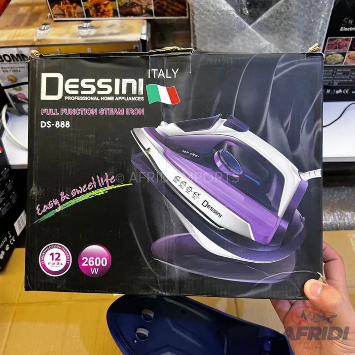 A Dessini DS-888 full function steam iron, purple and white, with 2600W power and a 12-month warranty.