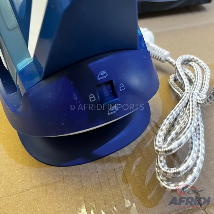 A blue steam iron with a detachable water tank and a patterned power cord.