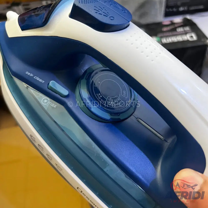 Blue and white steam iron with a water tank and temperature dial.