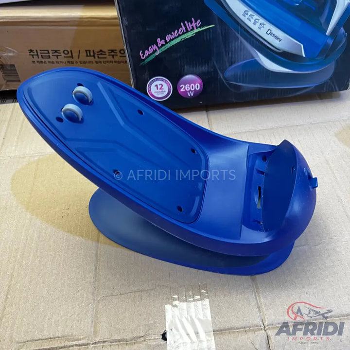 A blue plastic base for a steam iron, featuring two white rollers and a hollowed-out section for the iron to rest.
