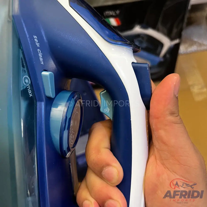 A blue and white handheld steam iron with a water tank and control dials.