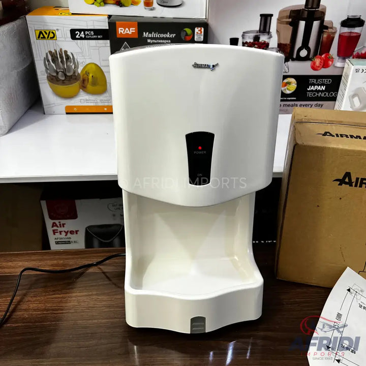 White automatic hand dryer.