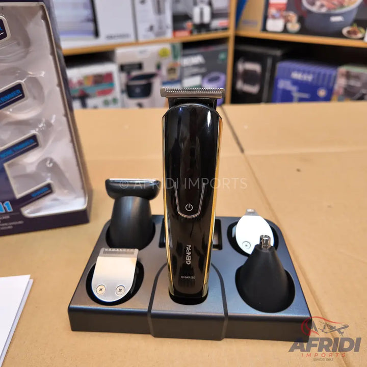 Black and gold multi-function grooming kit with various attachments and charging stand.