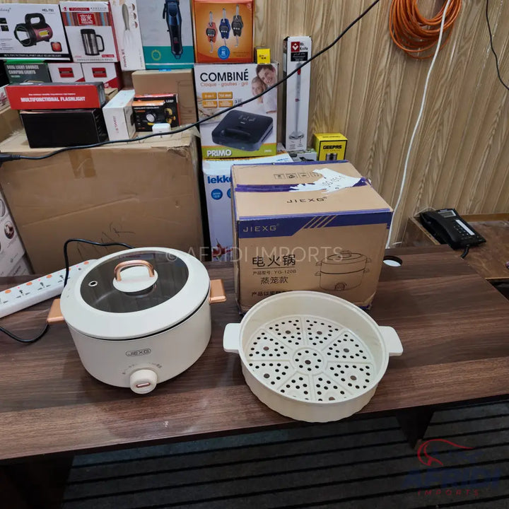 White electric multi-cooker with a transparent lid and a separate steamer insert.