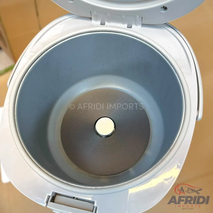An open, empty electric rice cooker with a non-stick inner pot.