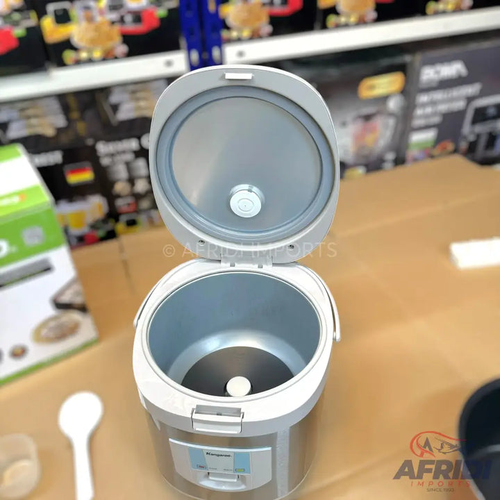 An open, silver and white rice cooker with a non-stick inner pot.