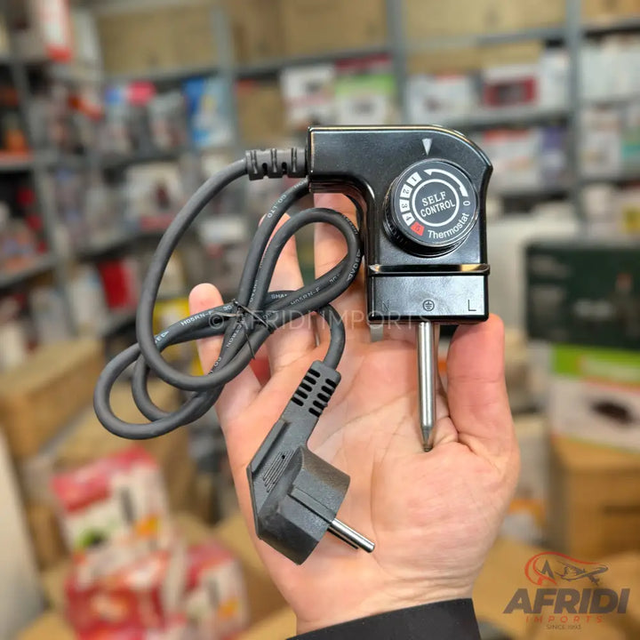 Black thermostat control unit with a two-pin European power plug.