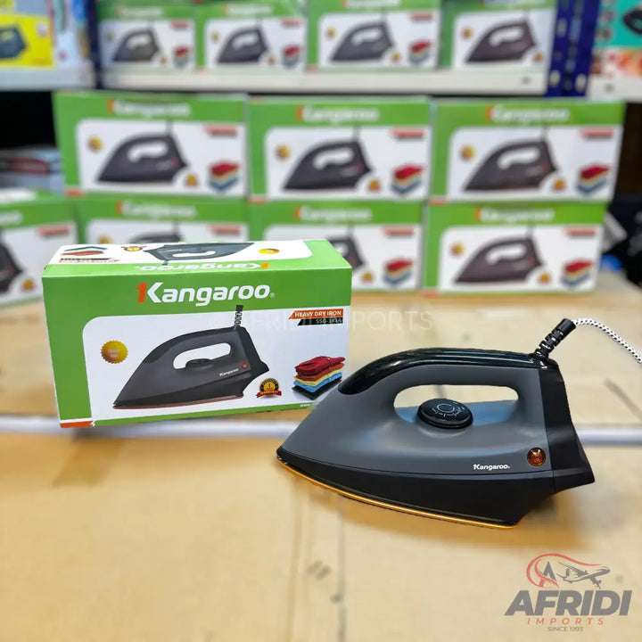 A dark gray and black dry iron with a temperature control dial, a power indicator light, and a silver cord.