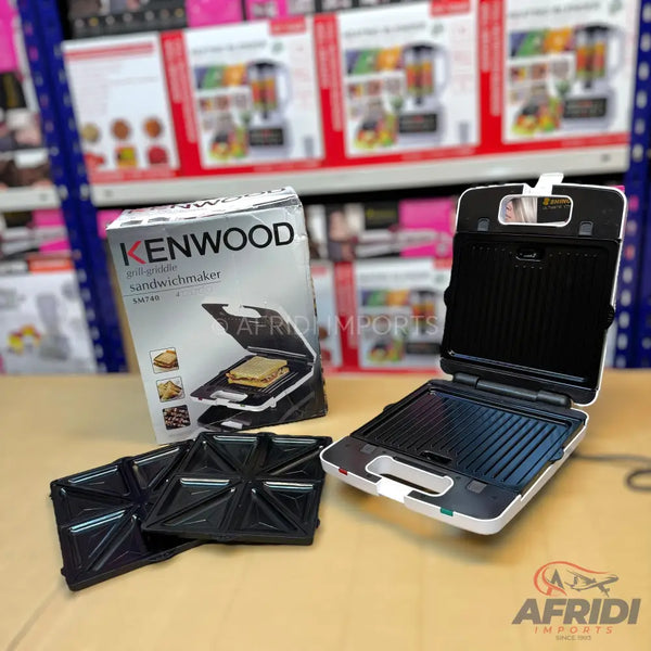 White Kenwood grill and sandwich maker with removable grill and sandwich plates.