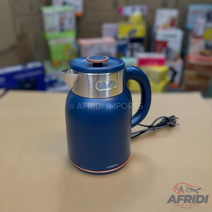 A dark blue electric kettle with a silver and rose gold trim.