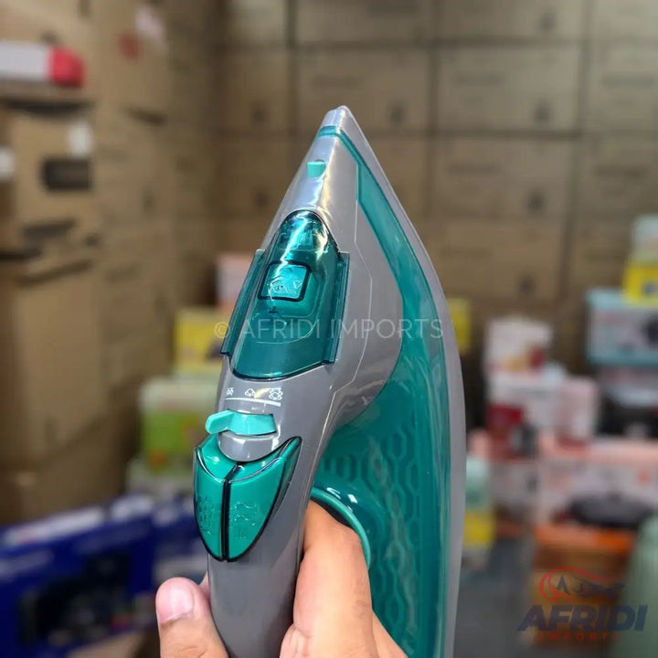 A grey and teal steam iron with a textured handle.