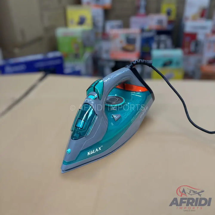 A teal and gray steam iron with a black power cord.